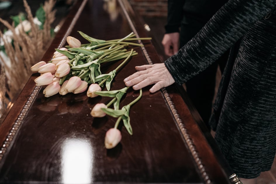 A Person Holding the Coffin